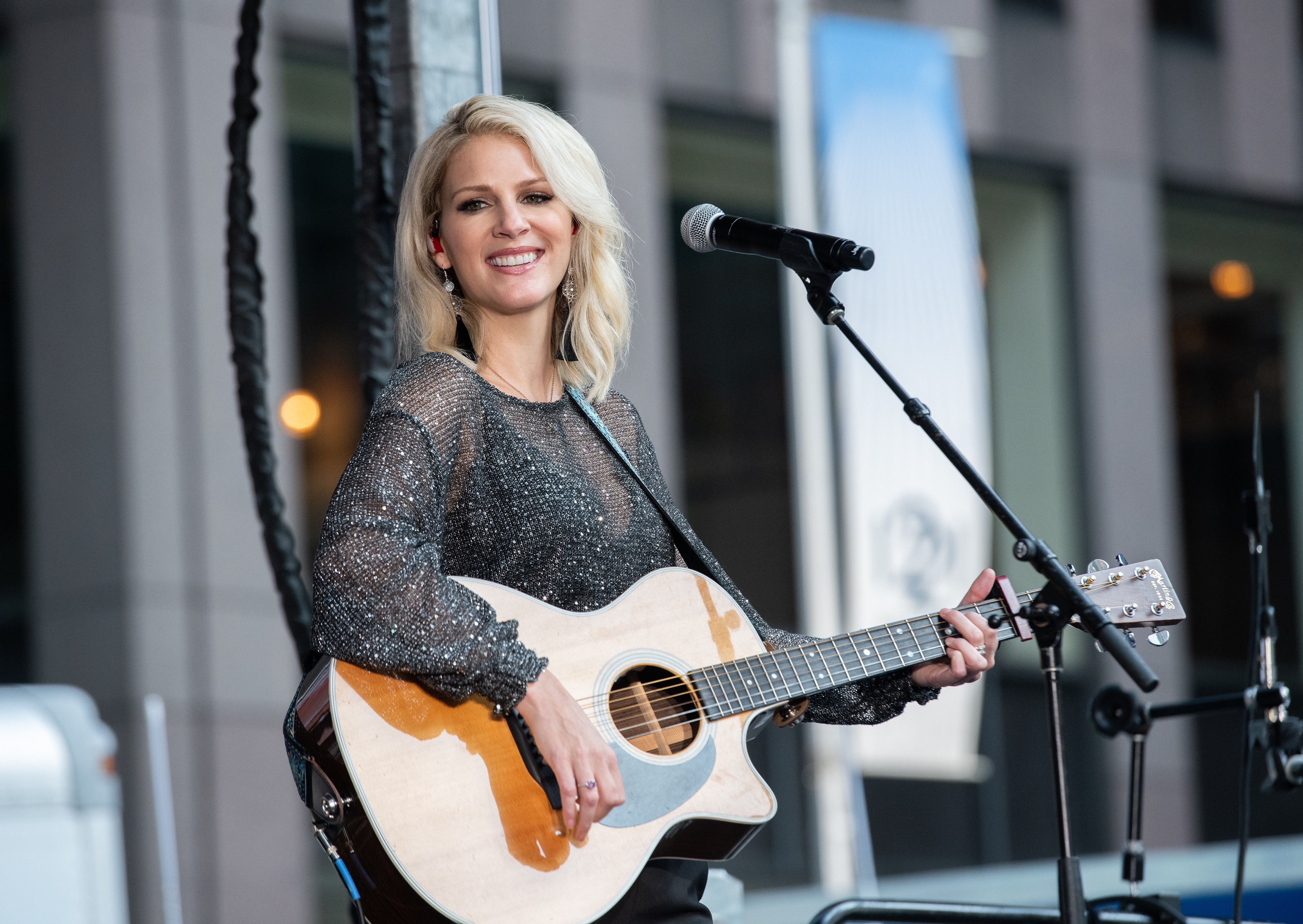 Jennifer Wayne with guitar